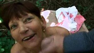  Slutty amateur granny feeds her desire for cock in the woods