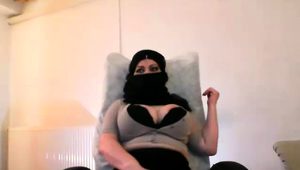  Masked webcam milf with big breasts fingers her aching pussy